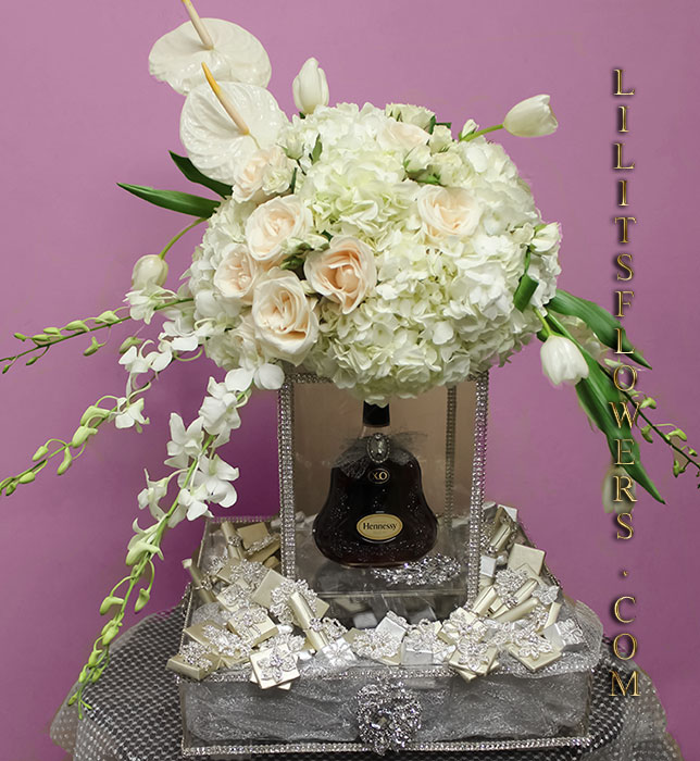 Florist in Glendale Flower Delivery - Wedding brandy and chocolate gift box with white flowers.
													Make sure to share with us your arrangement.
                                                    https://goo.gl/maps/Jgj1JeCetJv - Purple roses, purple dendrobium orchid - Glendale Florist