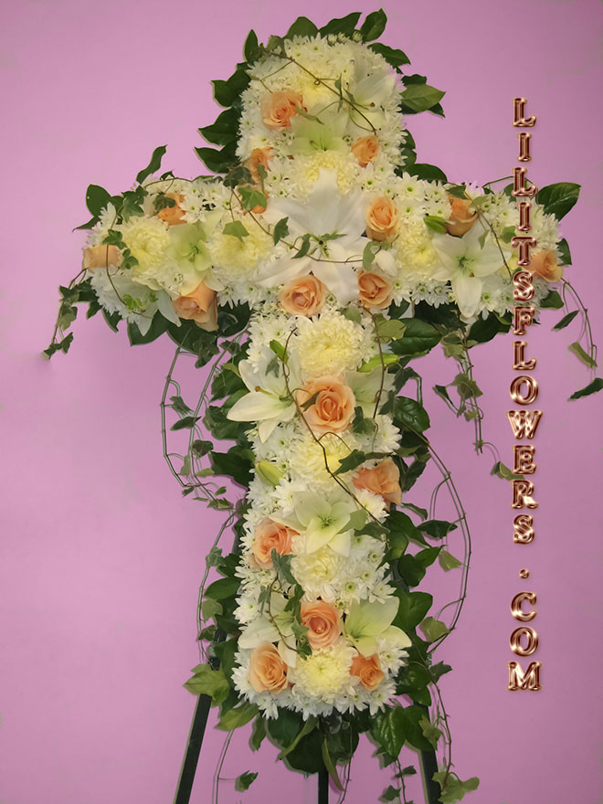 Funeral Florist in Burbank, CA Flower Delivery -beautiful funeral cross composed of peach roses, white lilies, white china mums-
Lilit's Flowers is the premier sympathy flower shop for Hollywood Hills and the surrounding towns. Order flowers online from Glendale Florist for same day local flower delivery from conveniently located shops in Southern California to send flowers to Glendale, Los Angeles,  Hollywood, Echo Park, Silver Lake, Atwater Village, Burbank, Sherman Oaks, La Cañada, Flintridge, Pasadena, San Marino, Alhambra, Arcadia, Thousand Oaks, Tarzana, Tujunga, La Crescenta,Toluca Lake and more.

Make sure to share with us your arrangement.
 https://goo.gl/maps/Jgj1JeCetJv - cross mix flowers  - Burbank Hollywood Hills
